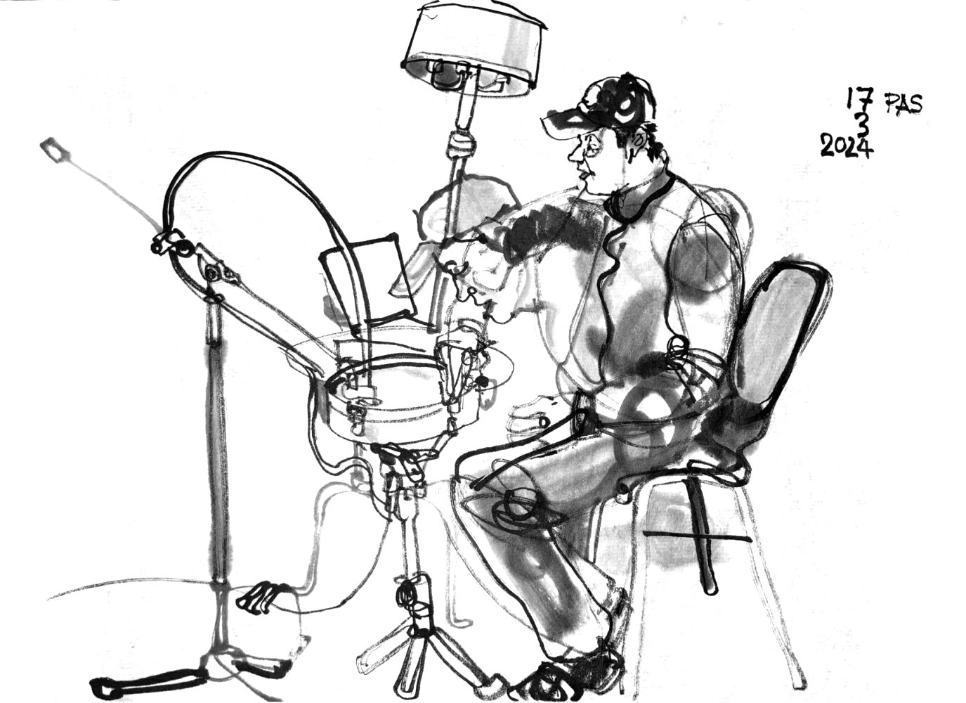 Ink drawing of a male musician sitting in front of a single drum, computer aside of it. A small device that is conected to a hose is touching the drums top, The musician manipulates one of the tuning scres with his right hand. His head is depicted in another pose, leaned forward, triggering the drum with his voice.