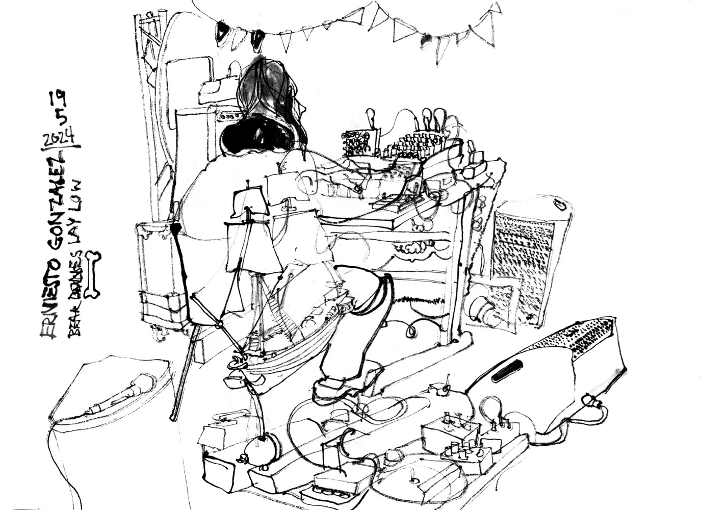Ink drawing of a musician at a desk with electronic devices.