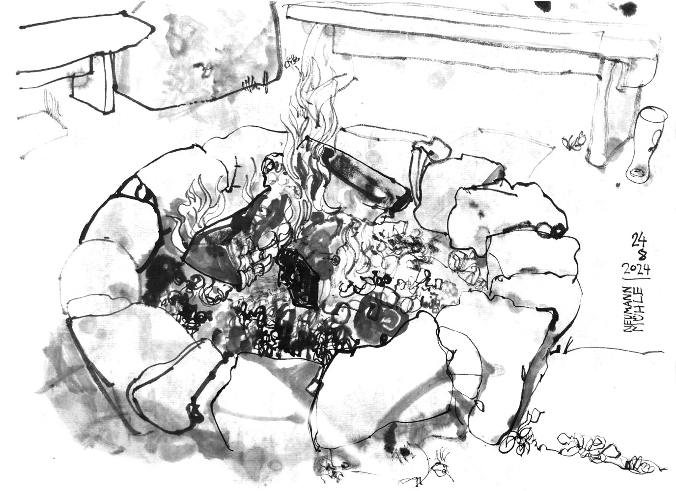 Ink drawing of a campfire in a stone ring, benches oposite of it.