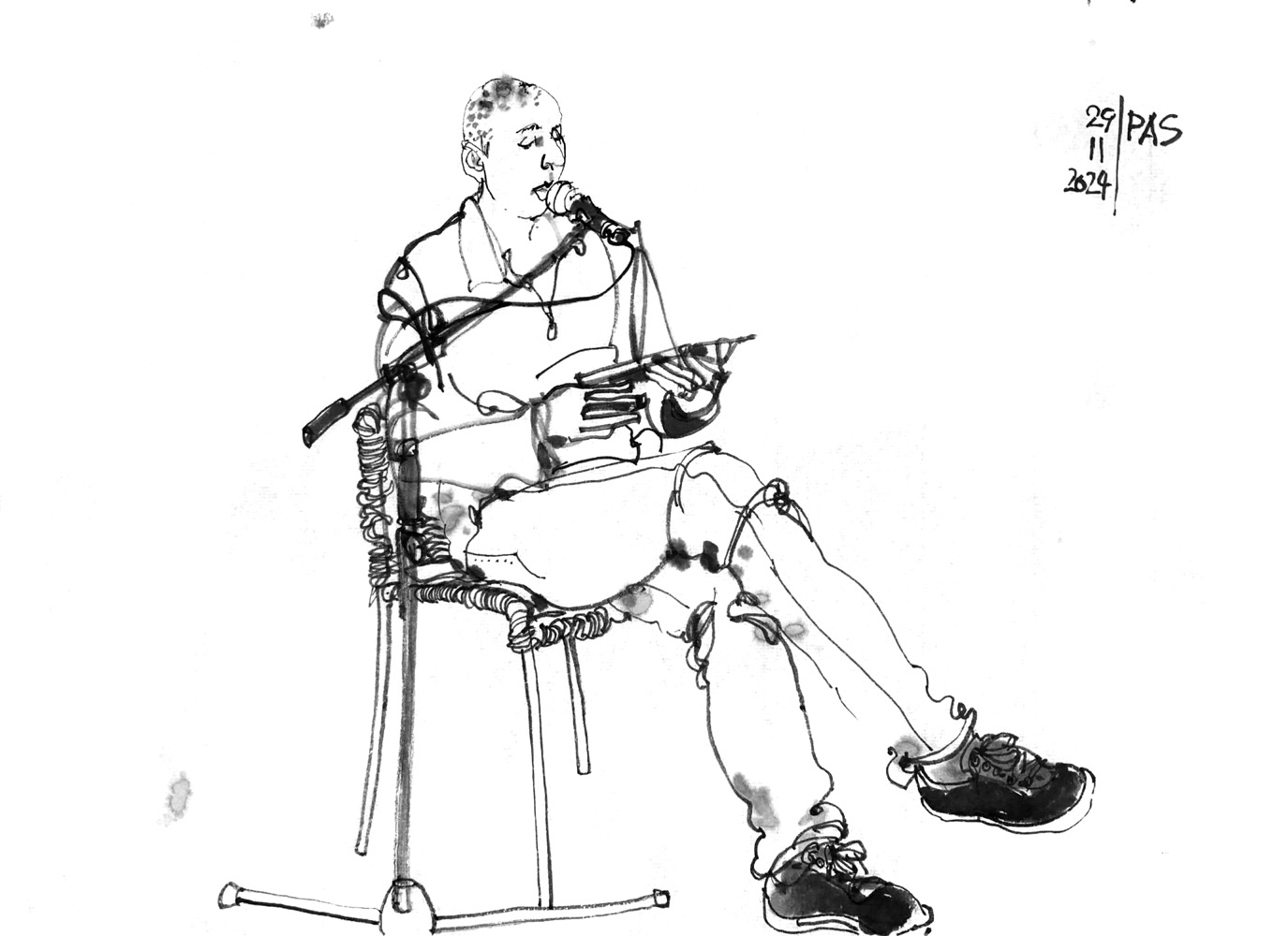 Ink drawing of a man, sitting on a chair and reading from a tablet.