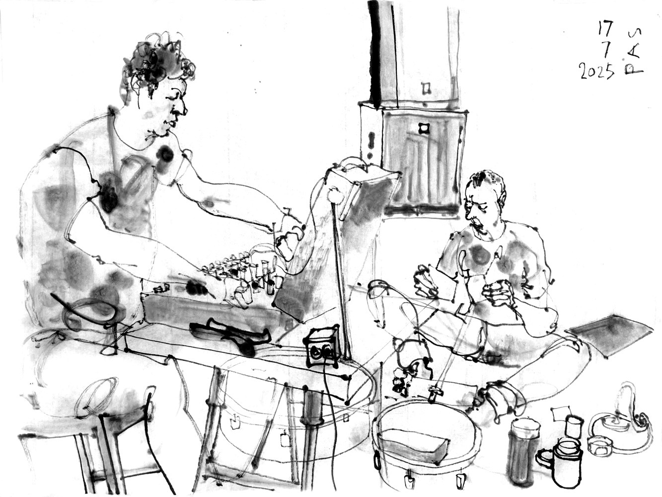Ink drawing of a man at a desk with a synthesizer and another man, sitting on the ground between flat drums and other objects, performing.